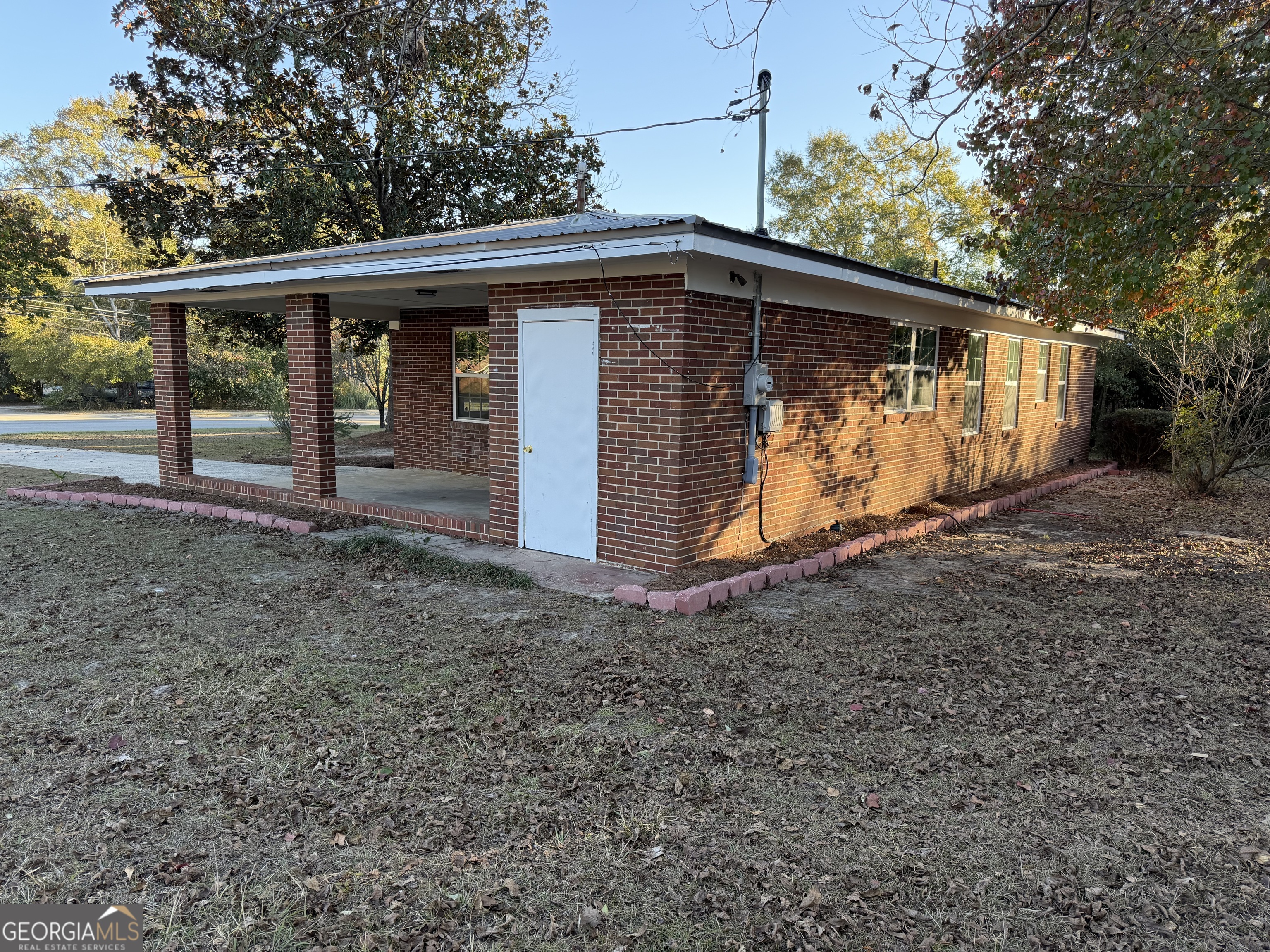 116 Country Club Road Dublin, GA 31021 - Photo 4 of 22 a view of a house with a yard