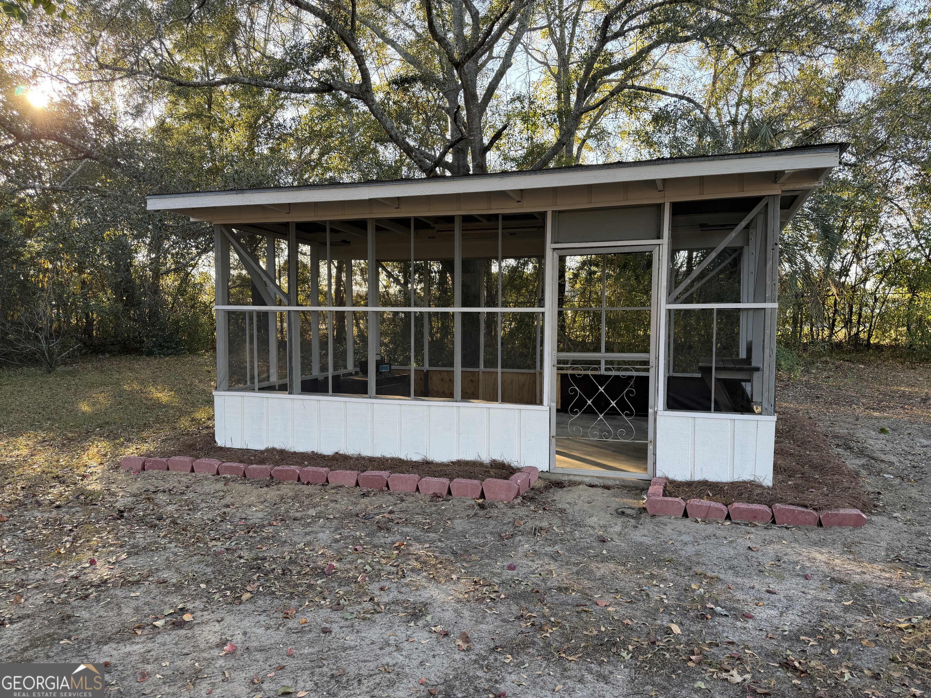 116 Country Club Road Dublin, GA 31021 - Photo 6 of 22 a view of a small house with a yard