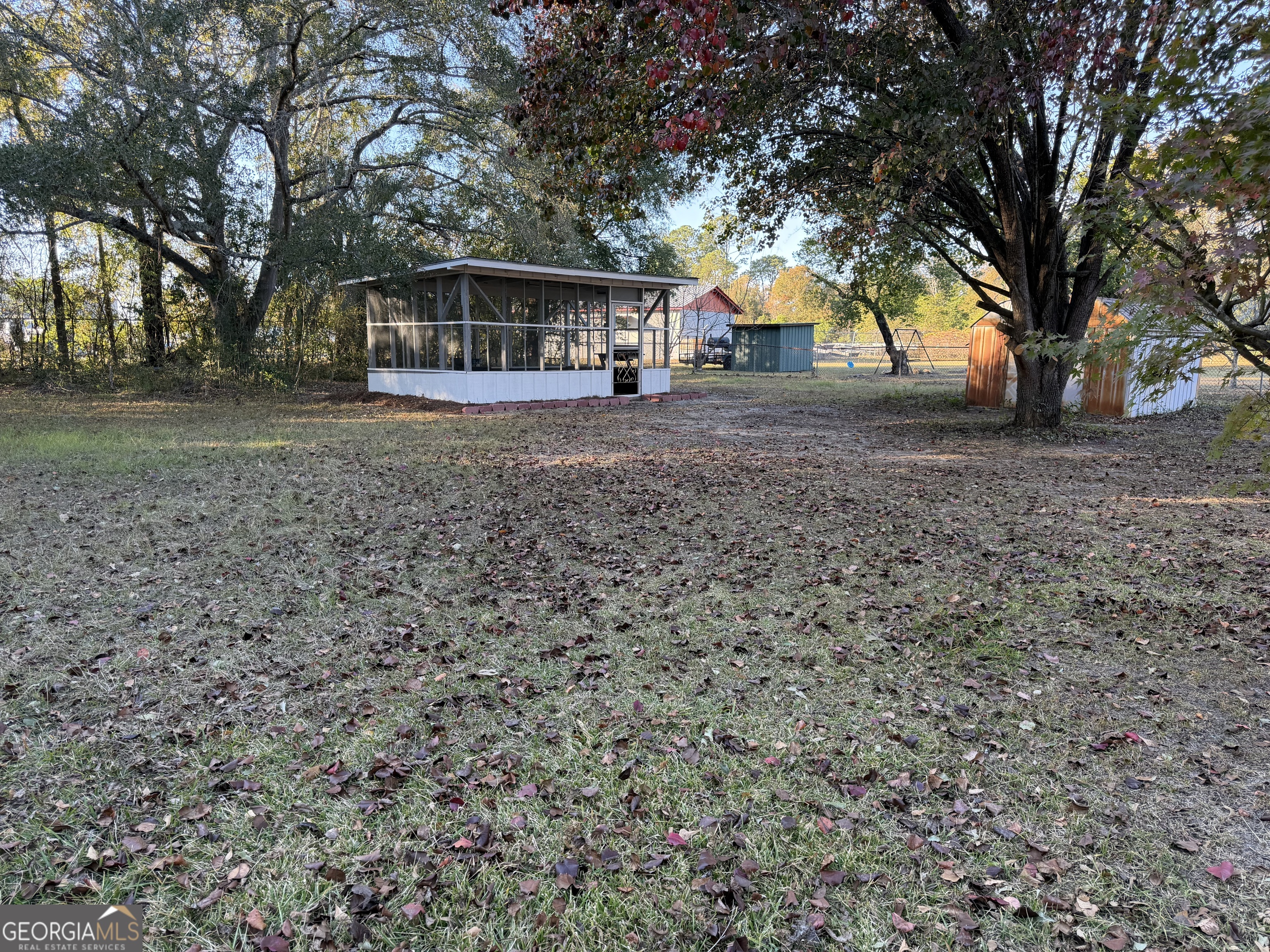 116 Country Club Road Dublin, GA 31021 - Photo 8 of 22 a view of house with outdoor space and garden