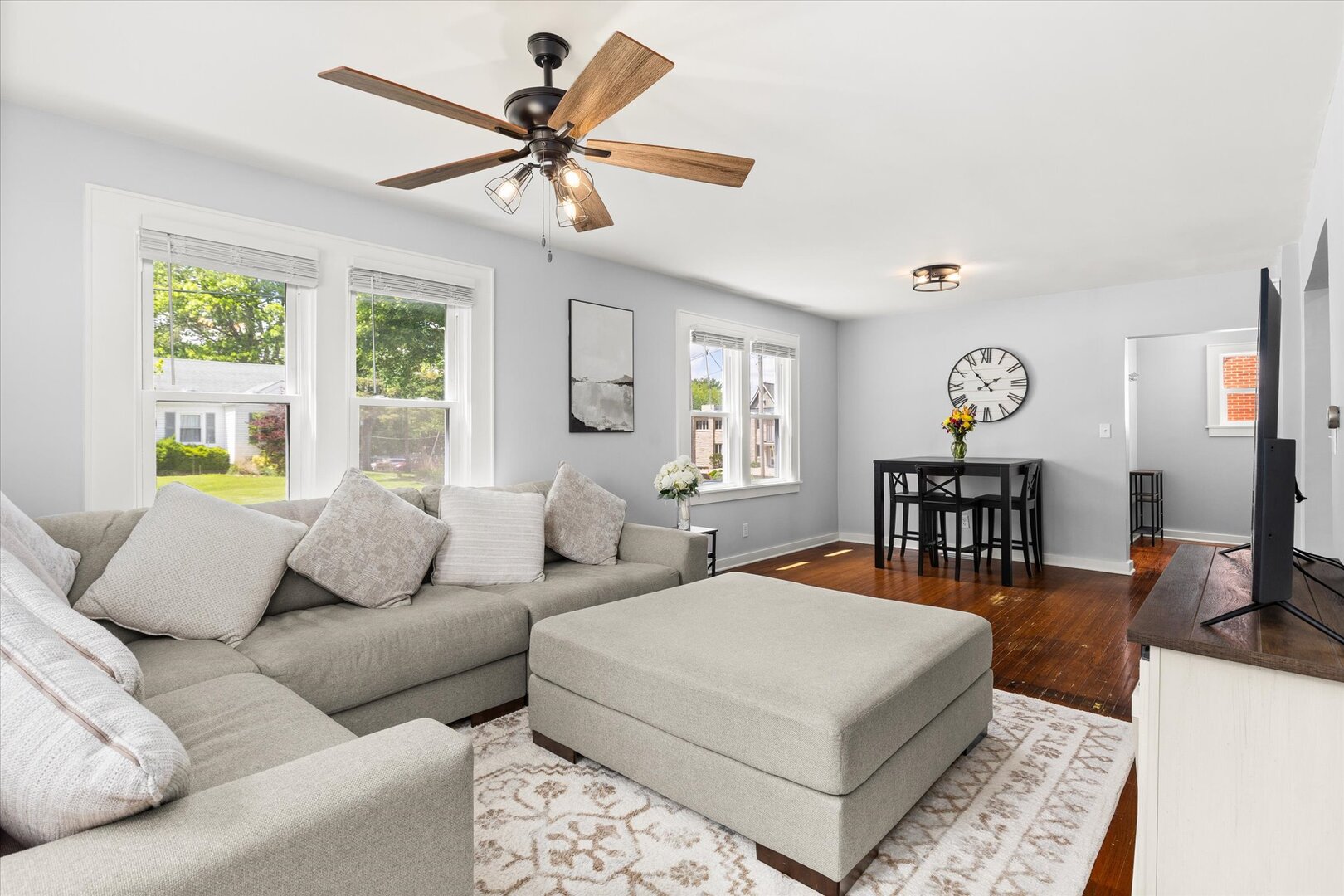 742 Chambers Street Ottawa, IL 61350 - Photo 12 of 39 a living room with furniture a chandelier and a large window