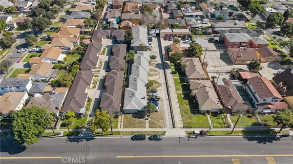 an aerial view of a residential apartment building with a yard