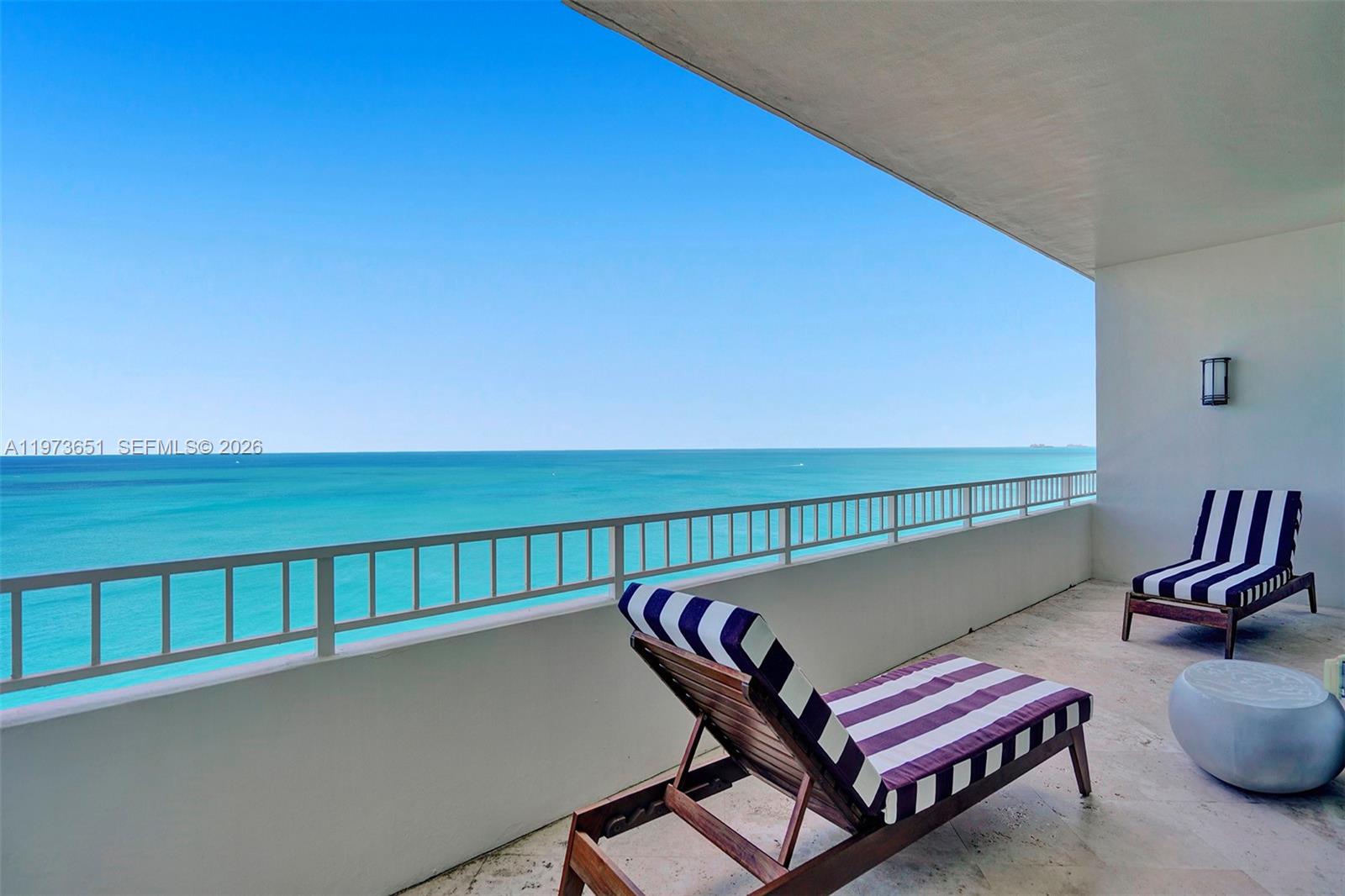 10205 Collins Avenue, Unit P8 Bal Harbour, FL 33154 - Photo 12 of 56 a view of a two chairs in a balcony