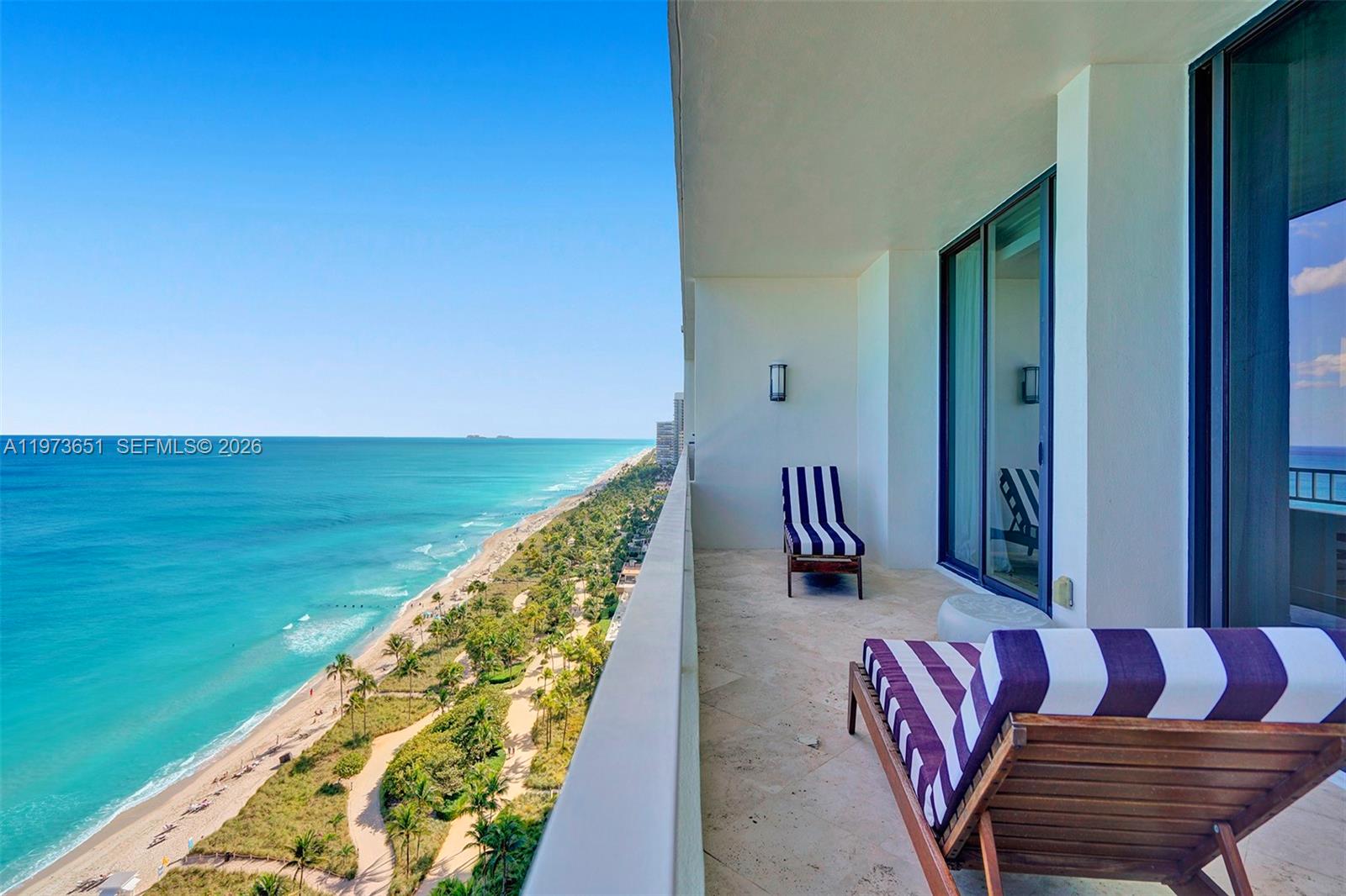 10205 Collins Avenue, Unit P8 Bal Harbour, FL 33154 - Photo 14 of 56 a balcony with furniture and garden