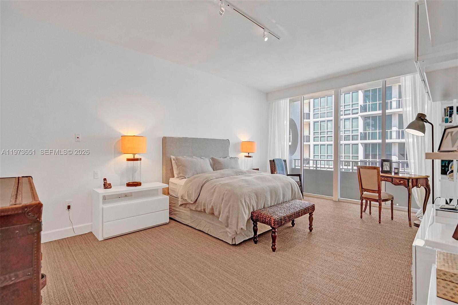 10205 Collins Avenue, Unit P8 Bal Harbour, FL 33154 - Photo 35 of 56 a bed room with a bed and a chair