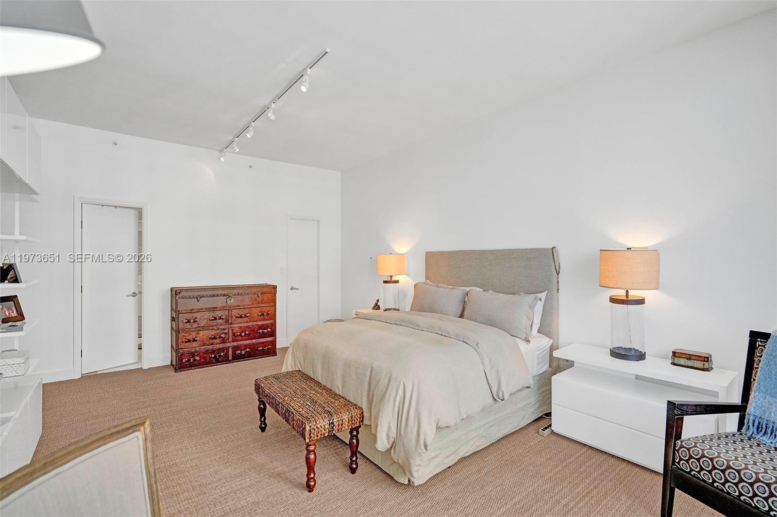 10205 Collins Avenue, Unit P8 Bal Harbour, FL 33154 - Photo 37 of 56 a bedroom with a bed and a couch