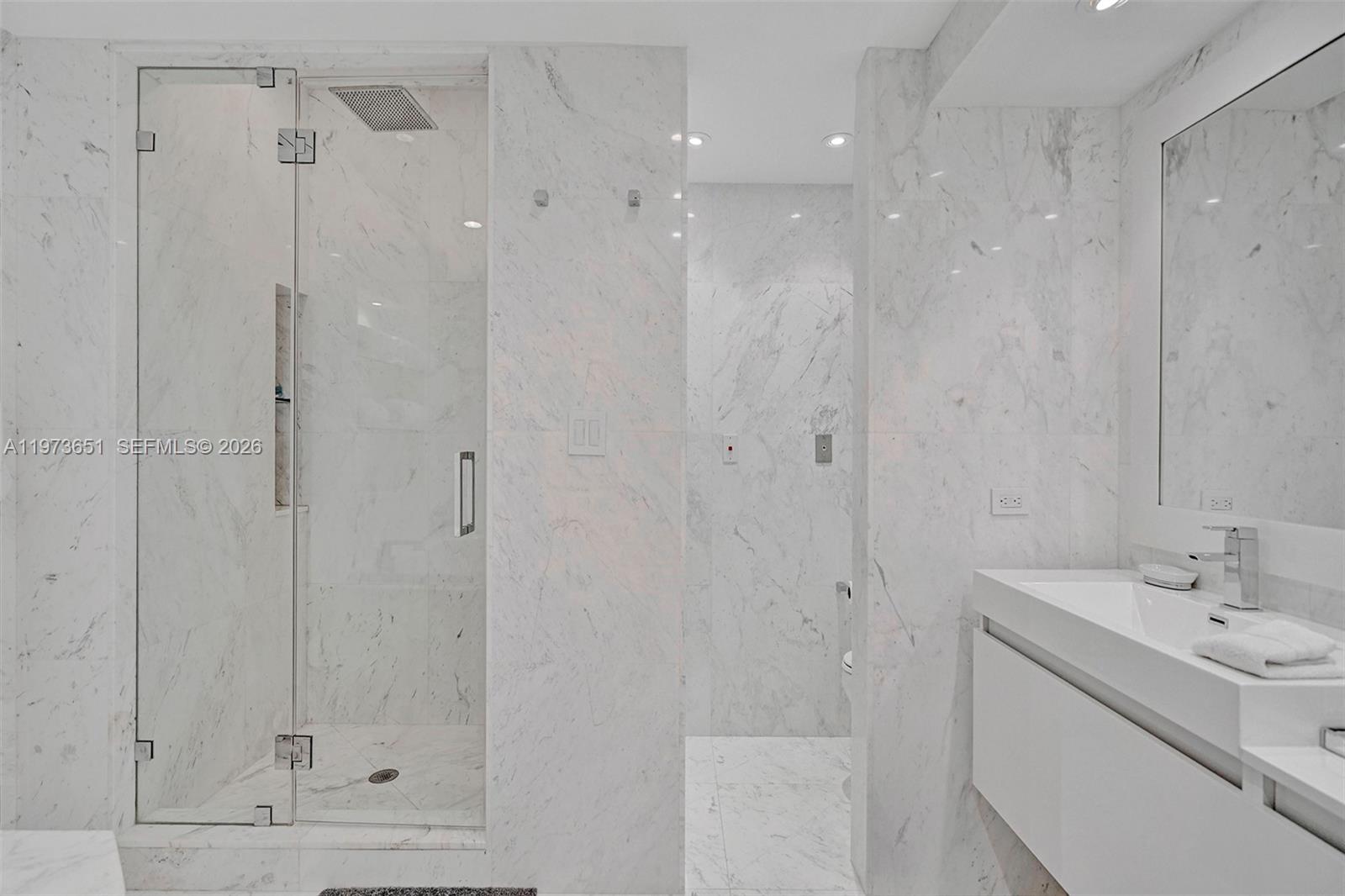 10205 Collins Avenue, Unit P8 Bal Harbour, FL 33154 - Photo 42 of 56 a bathroom with a shower and a sink