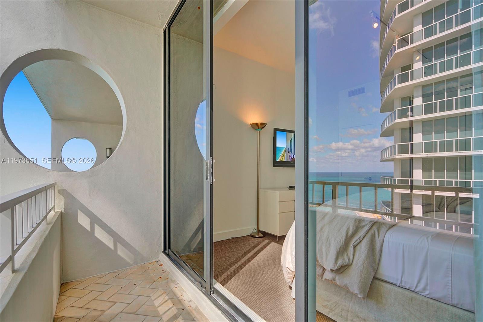 10205 Collins Avenue, Unit P8 Bal Harbour, FL 33154 - Photo 56 of 56 a view of a balcony door and furniture