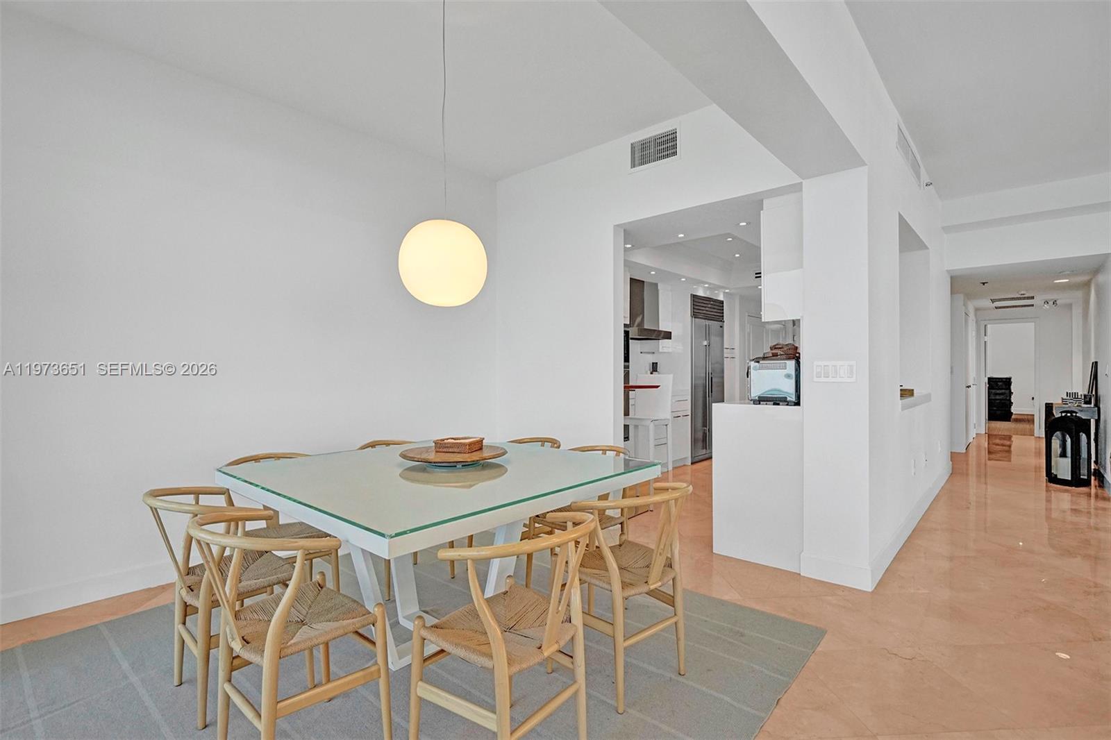 10205 Collins Avenue, Unit P8 Bal Harbour, FL 33154 - Photo 7 of 56 a view of a dining room with furniture