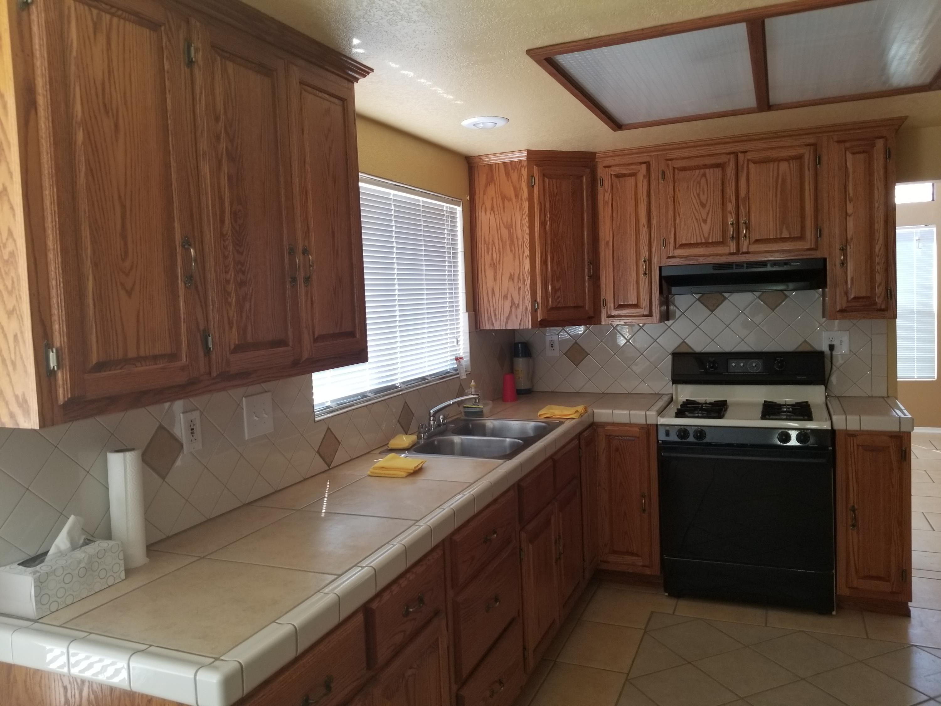 43724 Byron Drive Lancaster, CA 93535 - Photo 2 of 7 a kitchen with a sink stove top oven and cabinets