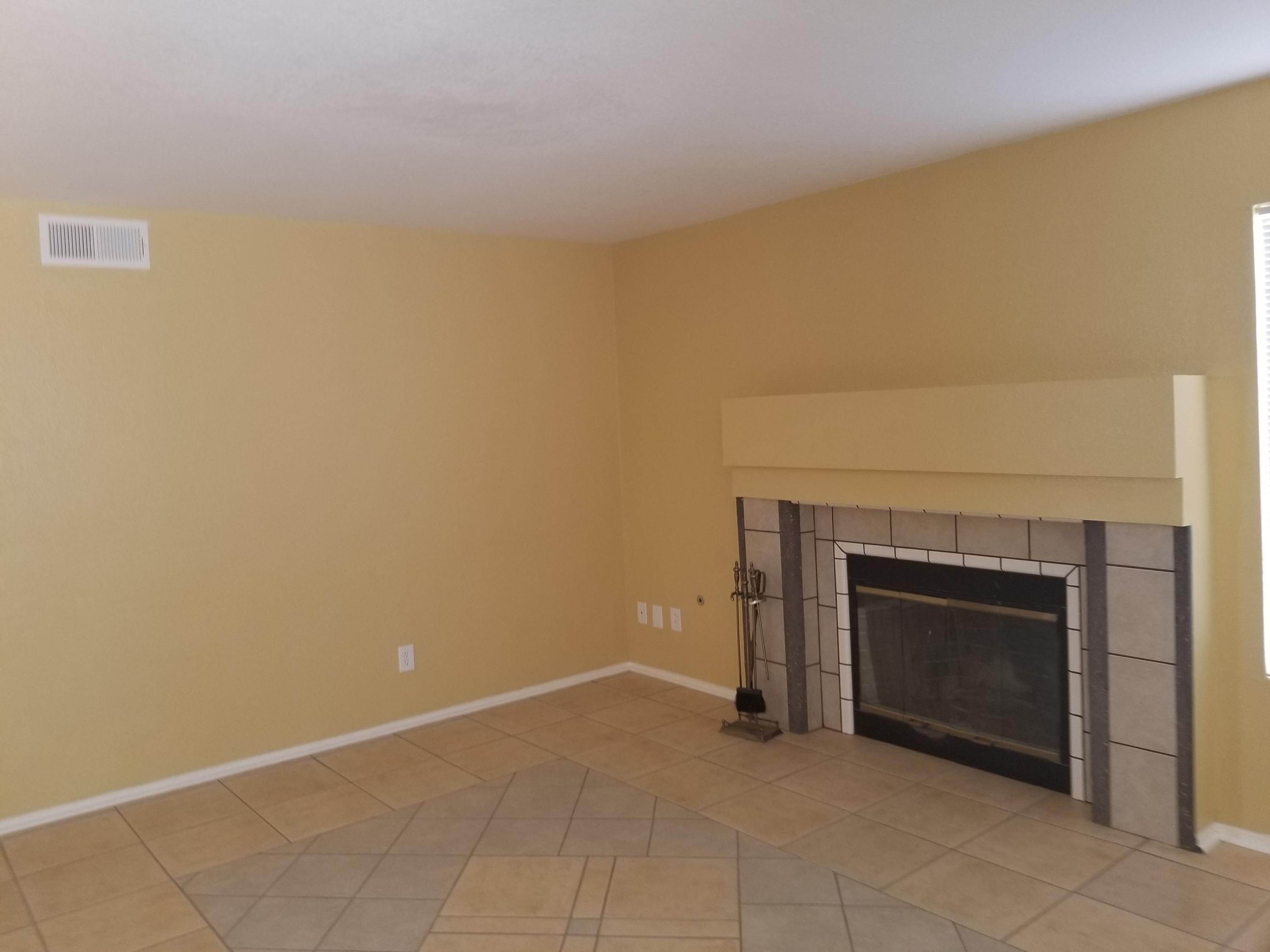 43724 Byron Drive Lancaster, CA 93535 - Photo 4 of 7 an empty room with a fireplace
