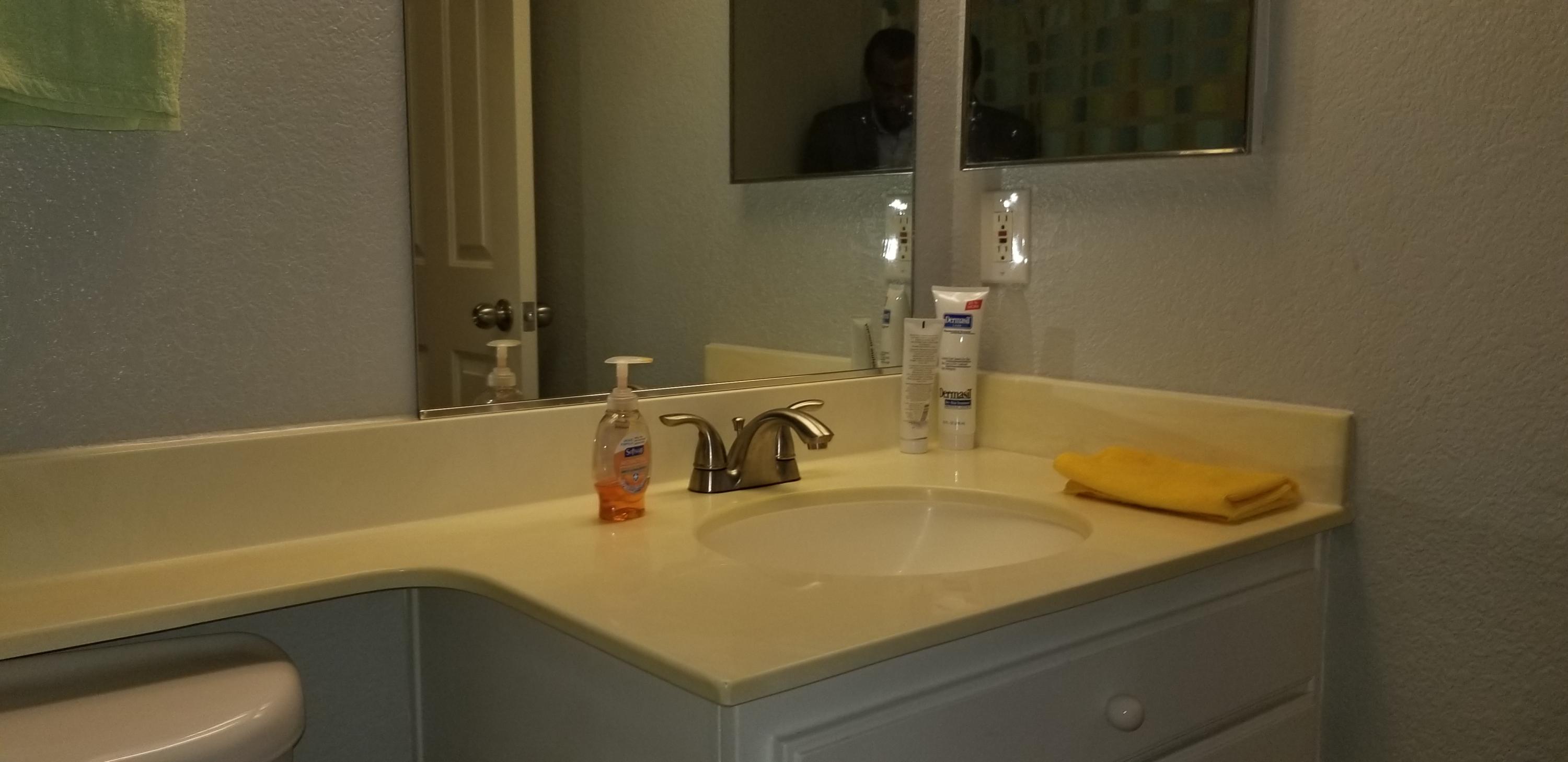 43724 Byron Drive Lancaster, CA 93535 - Photo 6 of 7 a bathroom with a sink and a mirror