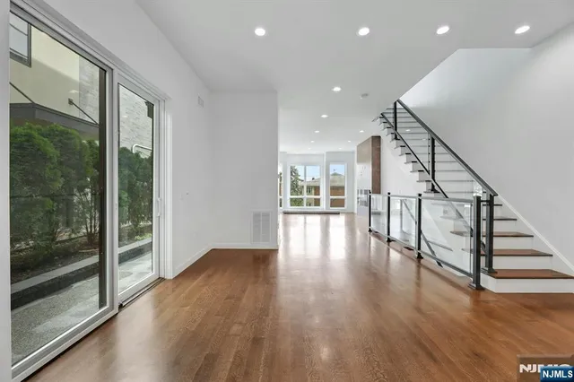 a view of entryway with wooden floor