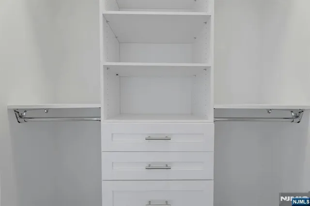 a view of an empty walk in closet