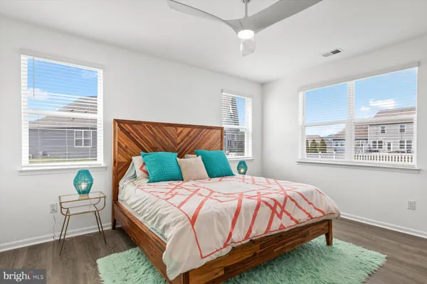 a bedroom with a bed and a couch