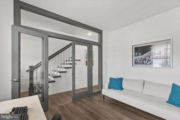 a swimming pool with outdoor seating and barbeque oven