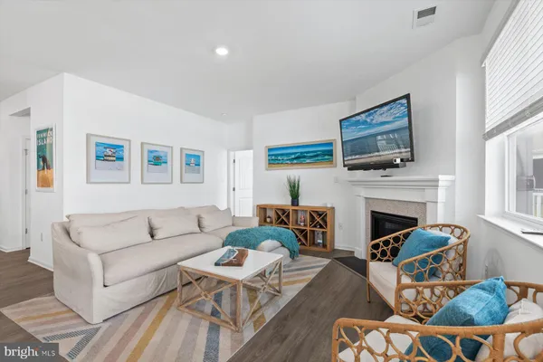 a view of a livingroom with workspace and a couch