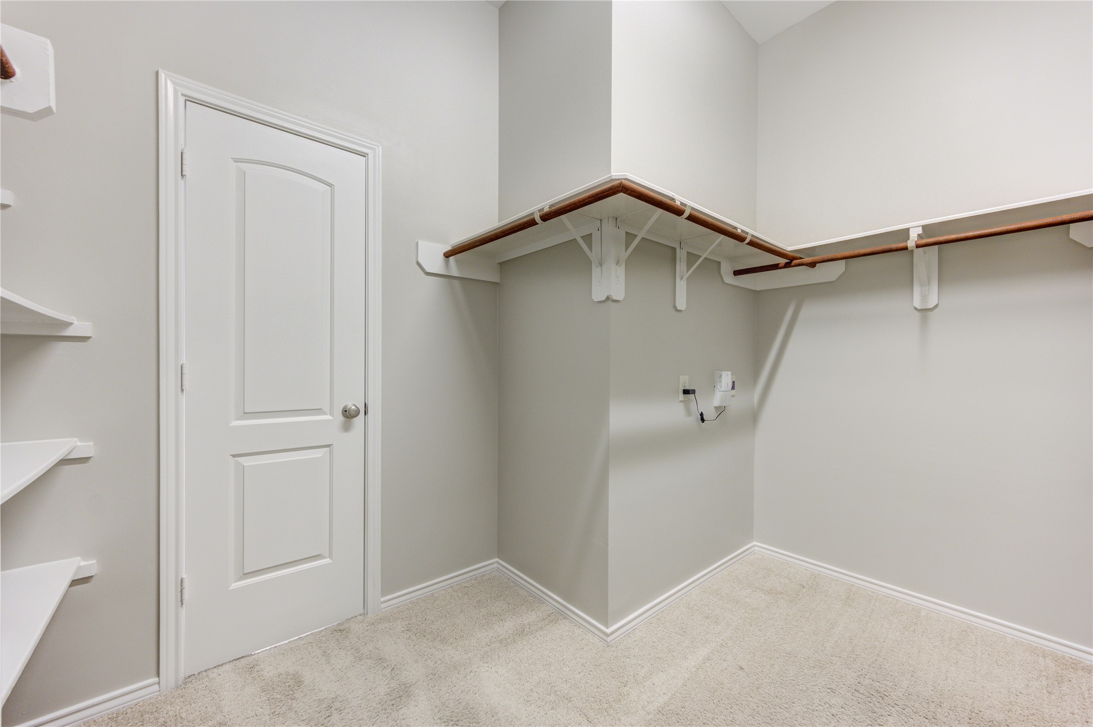 27407 Gatlin Lane Spring, TX 77386 - Photo 26 of 35 Enjoy exceptional storage in the oversized walk-in primary closet, complete with built-in shelving and abundant hanging space to keep everything organized and easily accessible.