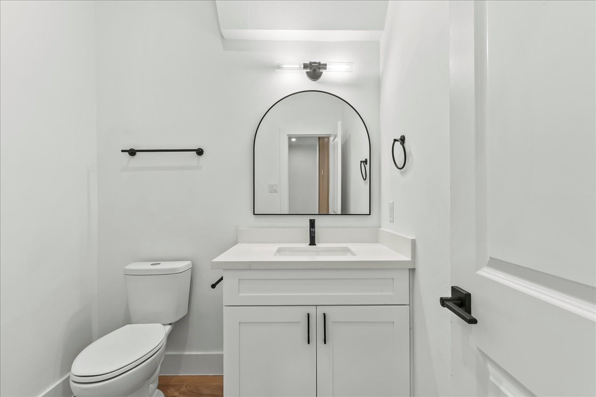 8323 Observatory Street, Unit A/B Houston, TX 77088 - Photo 20 of 38 Unit B - Spacious half bath featuring white quartz countertops, white cabinets, and modern fixtures.