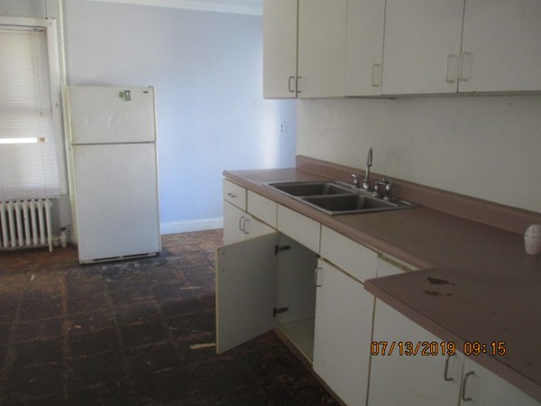 85 Ashley Street Springfield, MA 01105 - Photo 6 of 13 a kitchen with a sink and cabinets