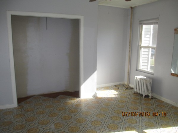 85 Ashley Street Springfield, MA 01105 - Photo 9 of 13 a view of empty room with wooden floor