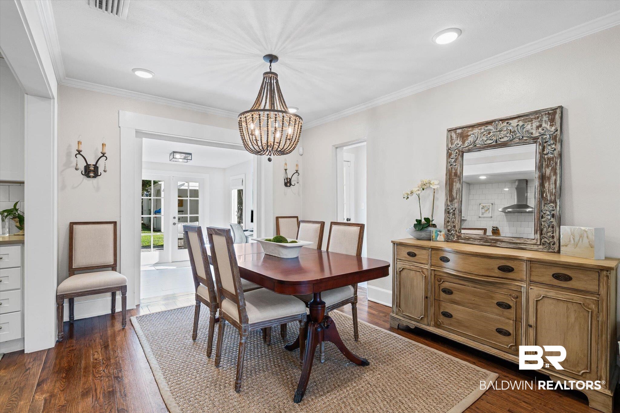 4310 The Cedars Avenue Mobile, AL 36608 - Photo 6 of 32 Dining area featuring ornamental molding, french doors, dark wood-style flooring, a chandelier, and recessed lighting