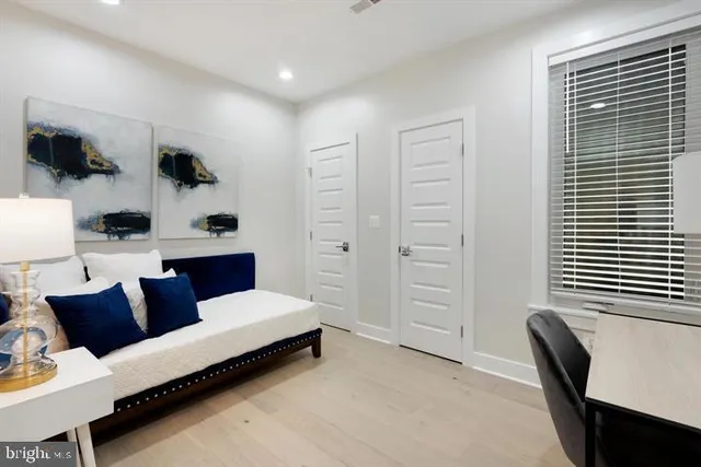 a living room with furniture and a window