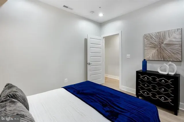 a bedroom with a bed and a closet