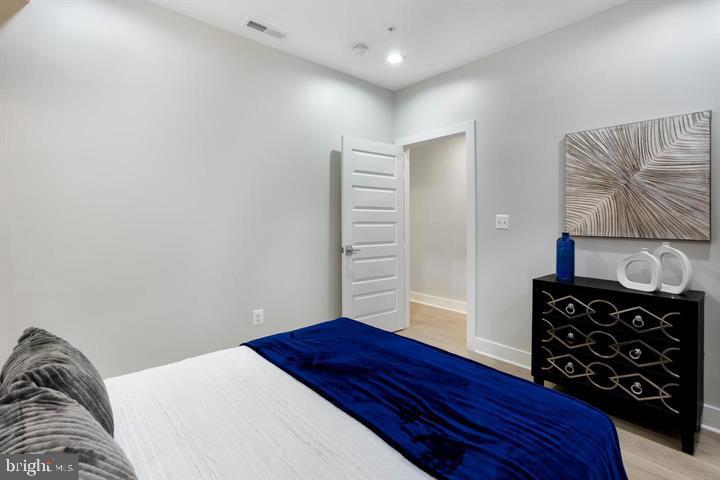 525 Kennedy Street Northwest, Unit 1 Washington, DC 20011 - Photo 16 of 27 a bedroom with a bed and a closet