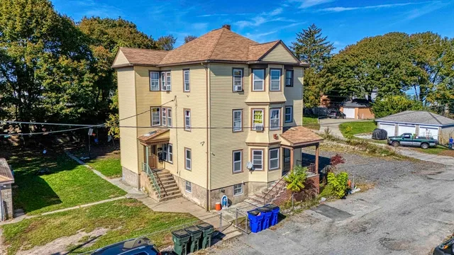 front view of a house with a yard