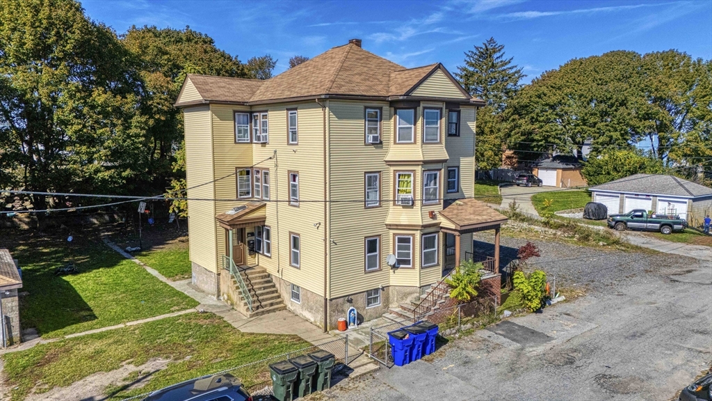 15 Higgins Street Fall River, MA 02724 - Photo 1 of 16 front view of a house with a yard