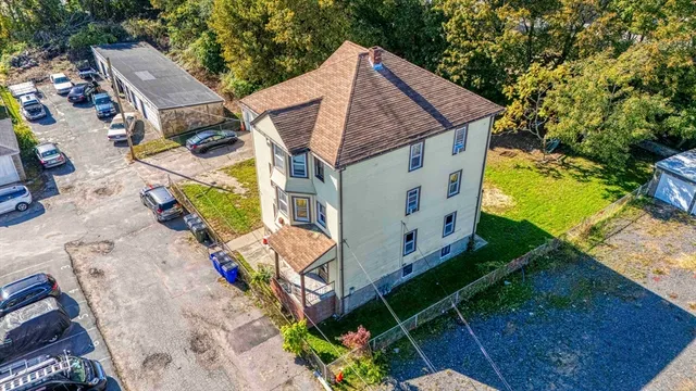 a aerial view of a house with a yard