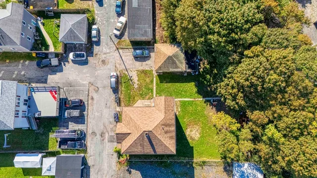 an aerial view of residential houses with outdoor space