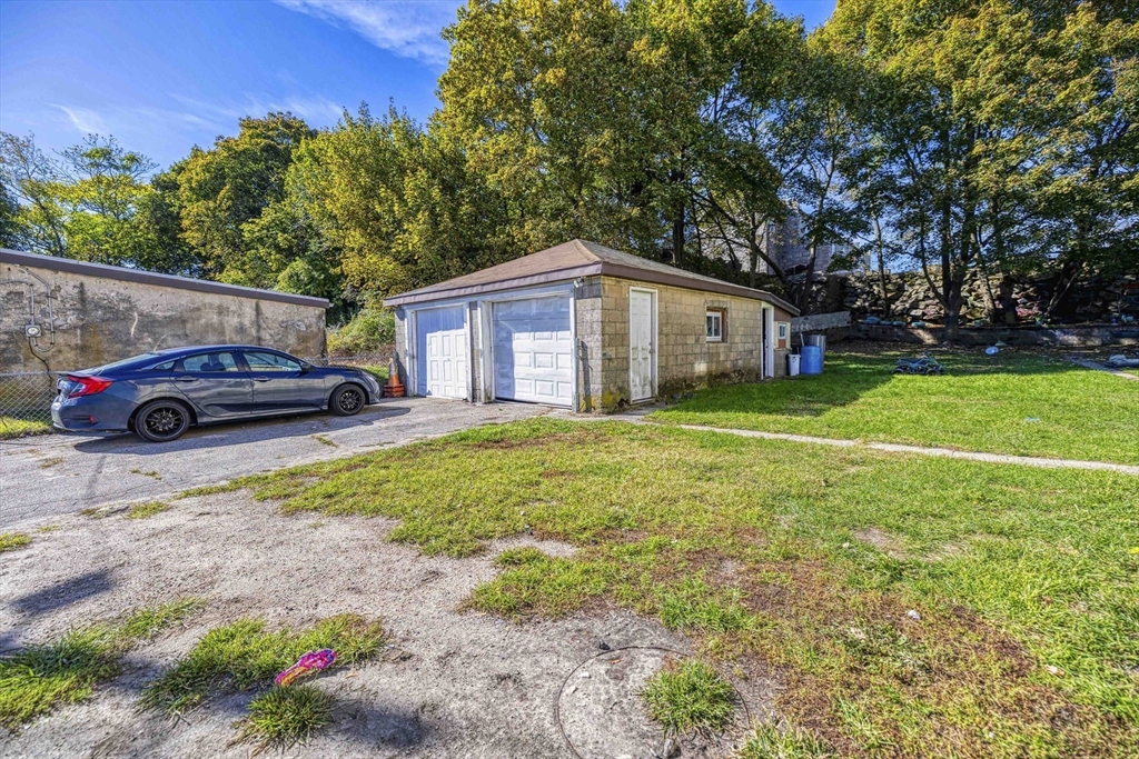 15 Higgins Street Fall River, MA 02724 - Photo 2 of 16 a front view of a house with garden