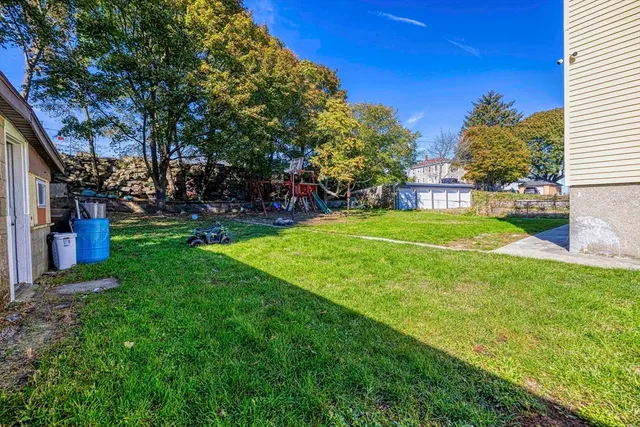 a view of a park with large trees