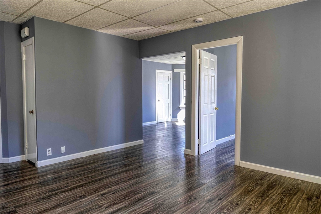 15 Higgins Street Fall River, MA 02724 - Photo 4 of 16 a view of a hallway with wooden floor