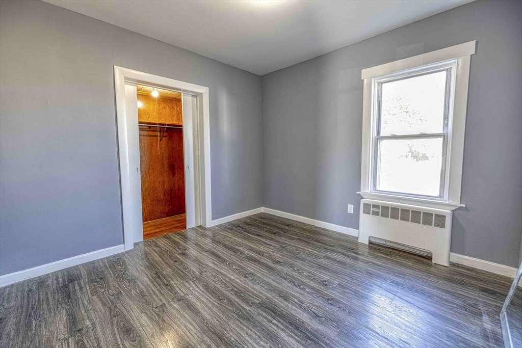 15 Higgins Street Fall River, MA 02724 - Photo 10 of 16 an empty room with windows and closet
