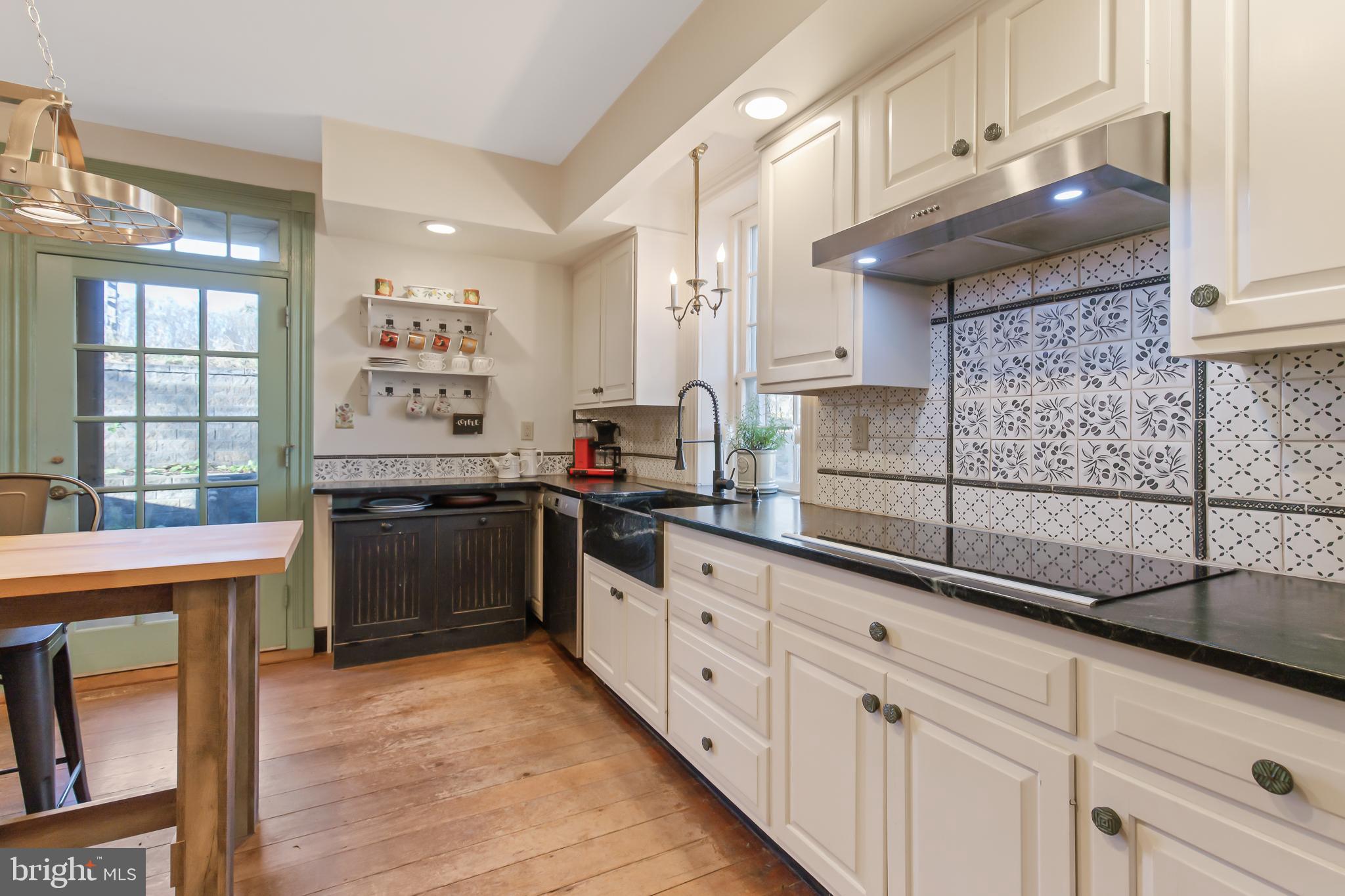 504 2nd Lock Road Lancaster, PA 17603 - Photo 15 of 52 a kitchen with granite countertop a sink stove and cabinets