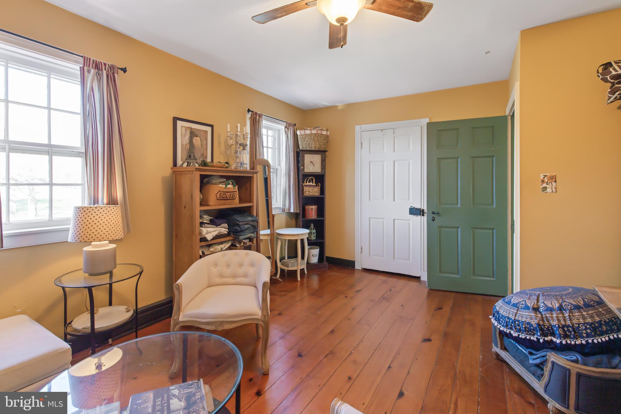 504 2nd Lock Road Lancaster, PA 17603 - Photo 26 of 52 a living room with furniture a dining table and a bookshelf