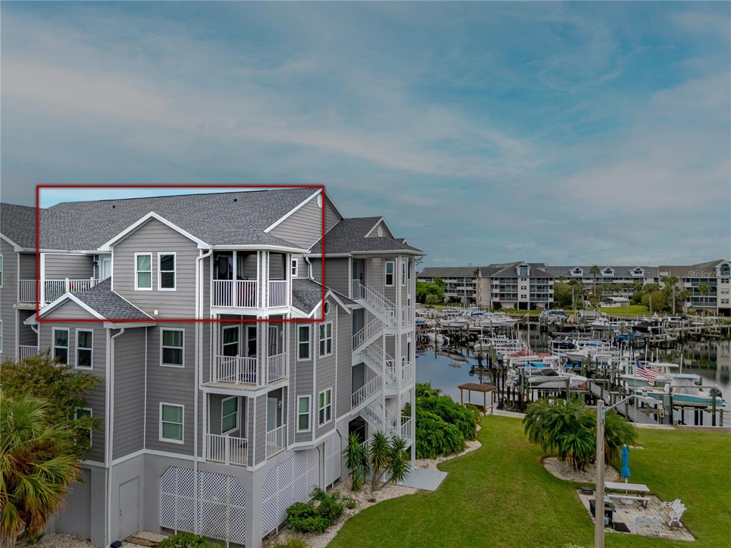 an aerial view of a house with a yard