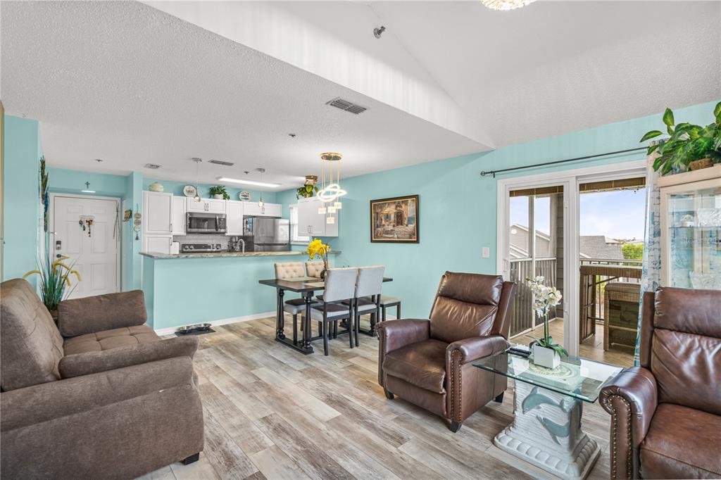 5722 Biscayne Court, Unit 308 New Port Richey, FL 34652 - Photo 12 of 31 a living room with furniture and a large window