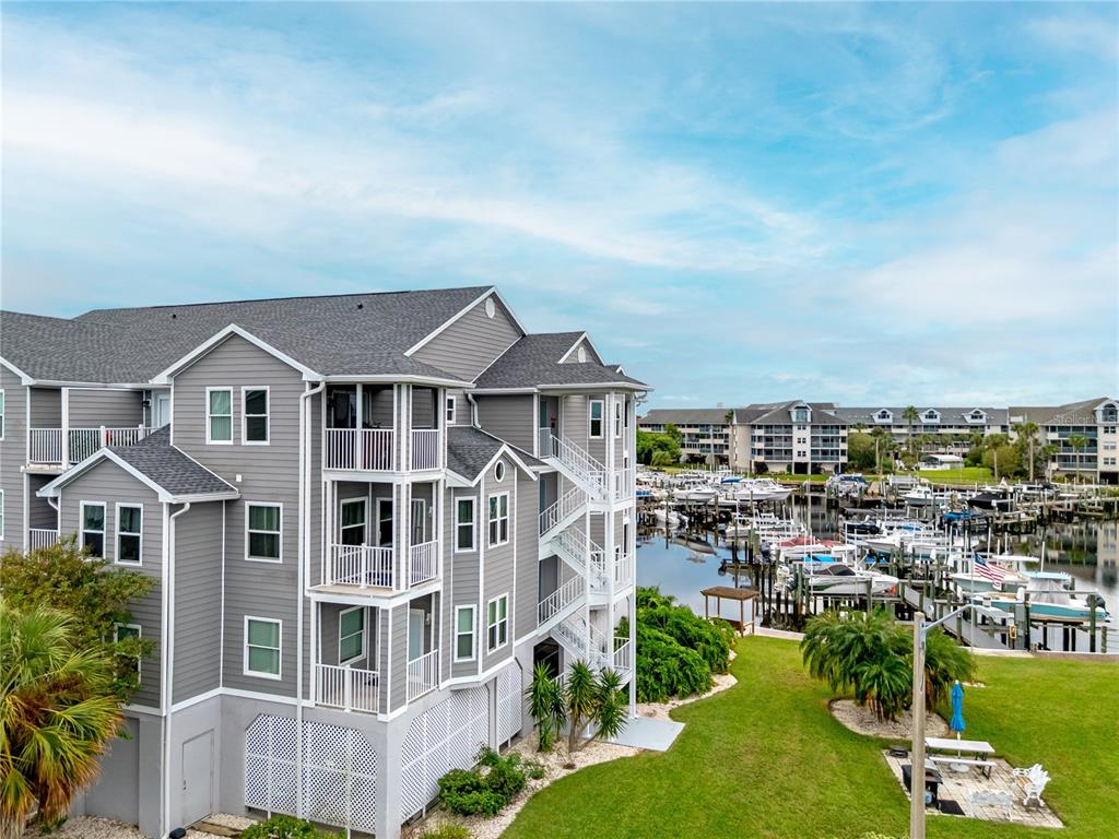 5722 Biscayne Court, Unit 308 New Port Richey, FL 34652 - Photo 2 of 31 an aerial view of a house with a yard