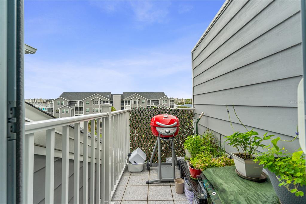 5722 Biscayne Court, Unit 308 New Port Richey, FL 34652 - Photo 21 of 31 a view of a chairs and table in a outdoor room
