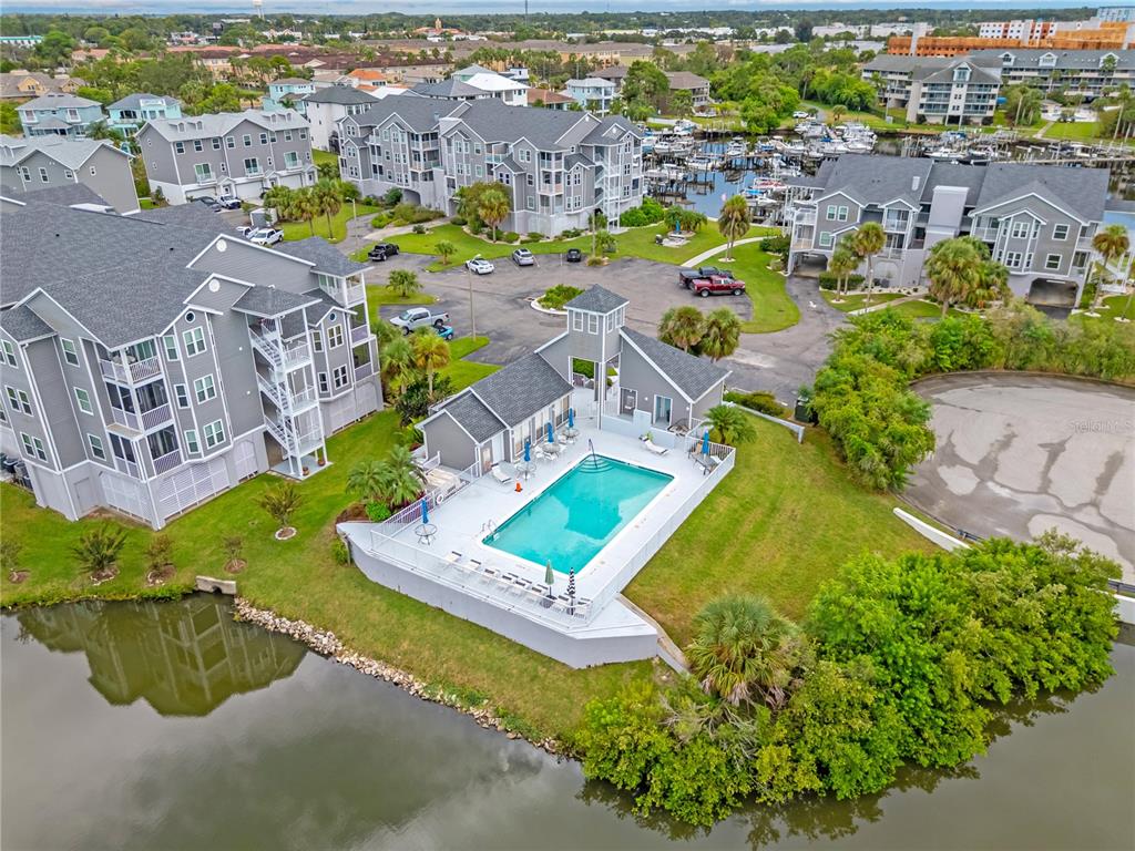 5722 Biscayne Court, Unit 308 New Port Richey, FL 34652 - Photo 24 of 31 an aerial view of a house with a swimming pool yard and outdoor seating