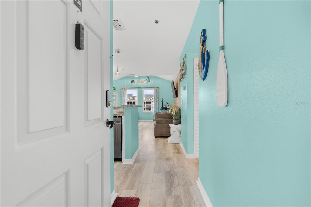 5722 Biscayne Court, Unit 308 New Port Richey, FL 34652 - Photo 3 of 31 a view of a kitchen from the hallway