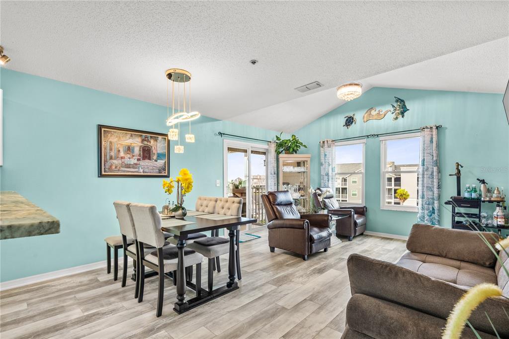 5722 Biscayne Court, Unit 308 New Port Richey, FL 34652 - Photo 9 of 31 a living room with furniture and wooden floor