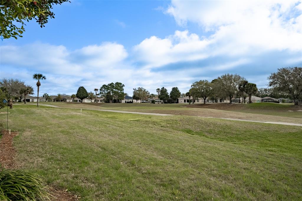 15969 Southwest 14th Avenue Road Ocala, FL 34473 - Photo 36 of 46 a view of a field with an trees in the background
