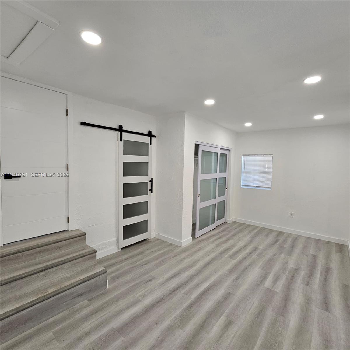 4020 Northwest 12th Avenue Miami, FL 33142 - Photo 13 of 13 a view of an empty room with a fireplace and cabinet