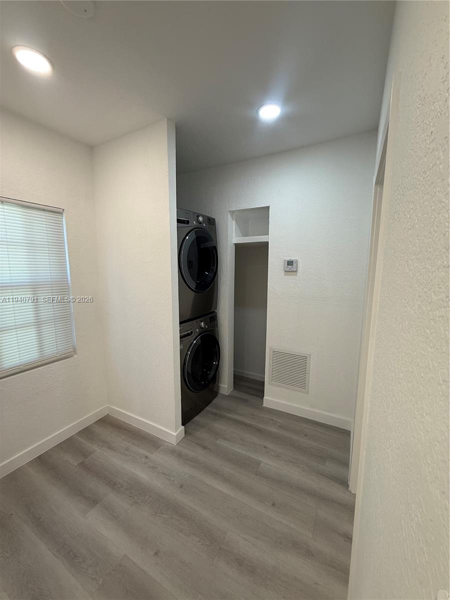 4020 Northwest 12th Avenue Miami, FL 33142 - Photo 6 of 13 an empty room with wooden floor and closet