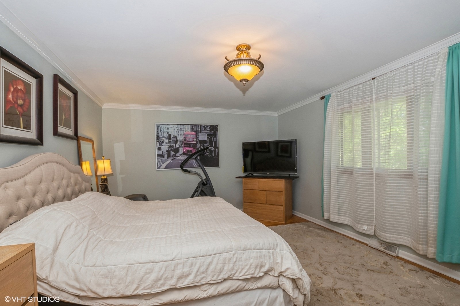 13011 South Shawnee Road Palos Heights, IL 60463 - Photo 18 of 28 a bedroom with a bed and a television