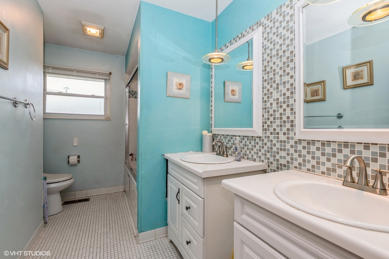 13011 South Shawnee Road Palos Heights, IL 60463 - Photo 20 of 28 a bathroom with a sink a toilet and a mirror